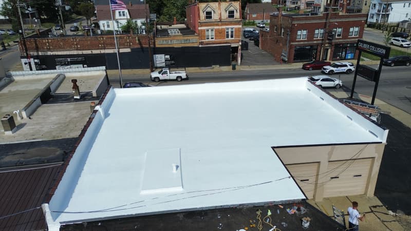 Aerial view of white flat commercial roof